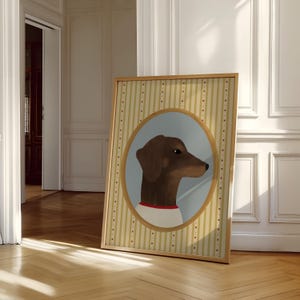 May include: A framed artwork featuring a brown dachshund dog in profile, set against a light blue oval. The dog wears a white shirt with a red collar. The background has a striped pattern with small red dots.