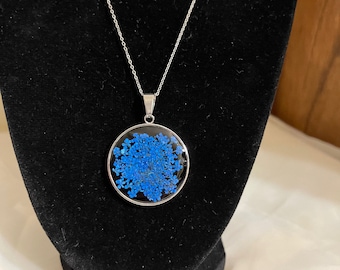Silver pressed flower necklace with blue flowers