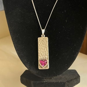Silver pendant with crushed glass filled heart