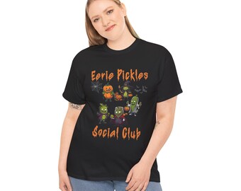 May include: Black t-shirt with a graphic of cartoon pickles dressed in Halloween costumes. The text "Eerie Pickles Social Club" is printed on the shirt.