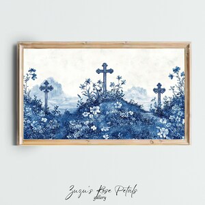 May include: A blue and white watercolour print of three crosses in a field of flowers. The crosses are surrounded by blue flowers and leaves, and the background is a light blue sky with clouds.