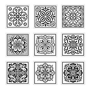 May include: Nine black and white square tiles with intricate floral designs. Each tile features a different pattern with symmetrical floral motifs.
