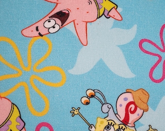 May include: A light blue fabric featuring cartoon characters Patrick Star and SpongeBob SquarePants. Patrick is pink and wearing a yellow shirt. SpongeBob is yellow and wearing a brown tie and pants. The background has flower and star shapes.
