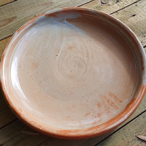 Large shino platter in woodfired stoneware to give a orange peach colour