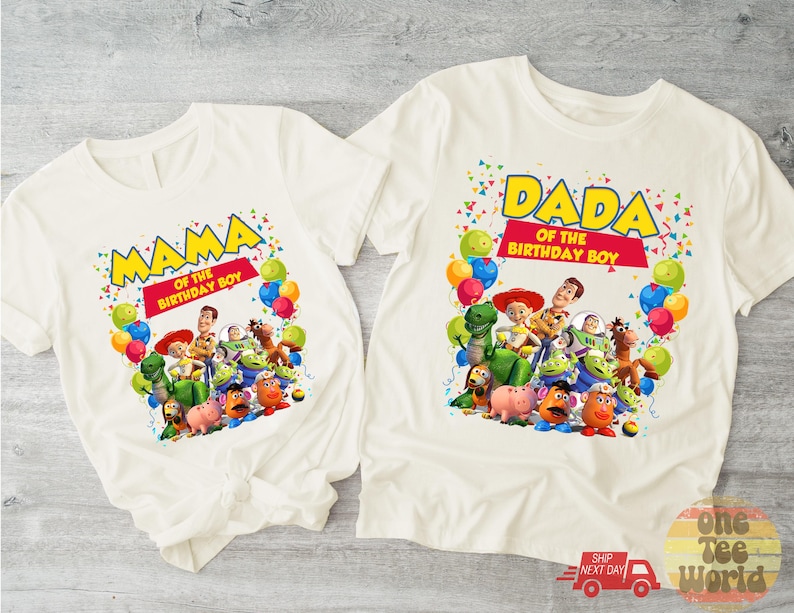 May include: Two white t-shirts with colorful graphics. One shirt says "MAMA OF THE BIRTHDAY BOY" and the other says "DADA OF THE BIRTHDAY BOY". Both shirts feature Toy Story characters and balloons.