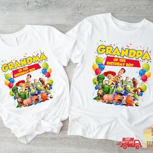 May include: Two white t-shirts with colorful graphics featuring characters from a popular animated movie. One shirt says "Grandma of the Birthday Boy" and the other says "Grandpa of the Birthday Boy".