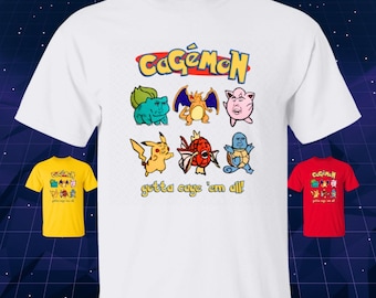 May include: White t-shirt with a colorful graphic featuring cartoon characters and the text "CaGeMoN" above and "gotta cage 'em all!" below. Additional yellow and red t-shirts with the same design are also visible.