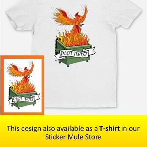 May include: White t-shirt featuring a graphic of a phoenix rising from a dumpster engulfed in flames. The design includes the text "PLOT TWIST" on a banner. A smaller framed version of the design is also shown.