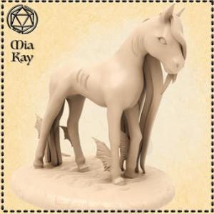 May include: A white unicorn figurine with a flowing mane and tail. The unicorn has a single horn and is standing on a base with a textured surface.