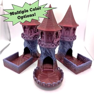 May include: Three 3D printed tower dice rolling trays in purple and red. The towers are detailed with windows and a spiral staircase. The trays are designed to hold dice.