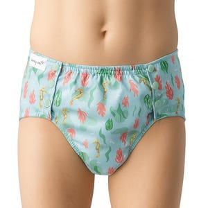 May include: Light blue reusable nappy with a sea-themed pattern. The nappy features seahorses, coral, and seaweed in gold, red, and green. It has snap closures on each side and the text "penny eel?" on the front.