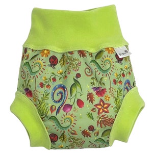 May include: A green and white reusable cloth diaper with a floral and ladybug print. The diaper has a green fleece lining and a label that says "Pippa & Jules".