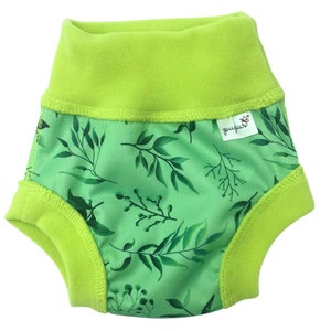 May include: Green and white reusable training pants with a leafy print and a green fleece lining. The pants have a label that says "pupsik*" on it.