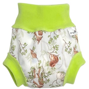 May include: Lime green reusable cloth diaper with a white print of woodland animals, including deer, squirrels, and birds, on branches. The diaper has a green elastic waistband and a tag that says "bumgenius".