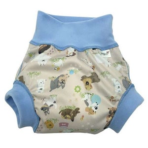 May include: A blue and white baby diaper cover with a print of various dogs and other animals. The diaper cover has a blue fleece lining around the leg openings and waist.