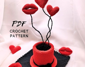 May include: A crochet pattern for a red heart and lips bouquet in a red top hat. The pattern is available as a PDF download.