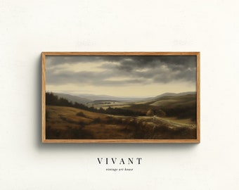 May include: A framed landscape painting depicting a rolling green valley with a cloudy sky. The painting is in a wooden frame and has the text "VIVANT vintage art house" below it.