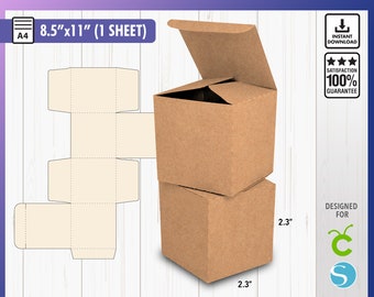 May include: A printable template for a cube box, shown as a brown cardboard box with a 2.3 inch side. The template is for a box that is 8.5 inches by 11 inches and is designed for crafts.