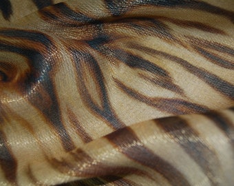New: Georgette Lamè Microdiamonds jnk print TP4550, continuously sold by the metre. Luxury viscose silk fabric with tiger print.