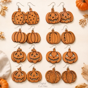 Peut inclure: Une collection de boucles d'oreilles en forme de citrouille en bois avec des crochets argent&eacute;s. Les boucles d'oreilles pr&eacute;sentent divers motifs sculpt&eacute;s, dont des visages de jack-o'-lantern, des points et des lignes verticales. Les boucles d'oreilles sont de couleur orange chaud, parfaites pour Halloween.