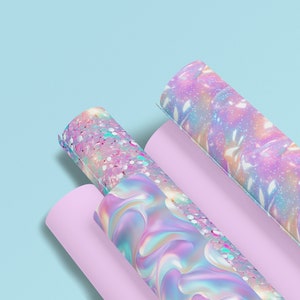 May include: Three rolls of iridescent wrapping paper with different patterns. The paper has a holographic finish and features a pink, blue, and purple color scheme.