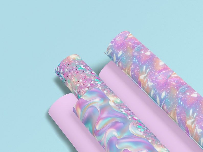 May include: Three rolls of iridescent wrapping paper with different patterns. The paper has a holographic finish and features a pink, blue, and purple color scheme.