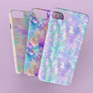 May include: Three iridescent phone cases with different mermaid scale patterns. The cases are all in shades of blue, purple, and pink.