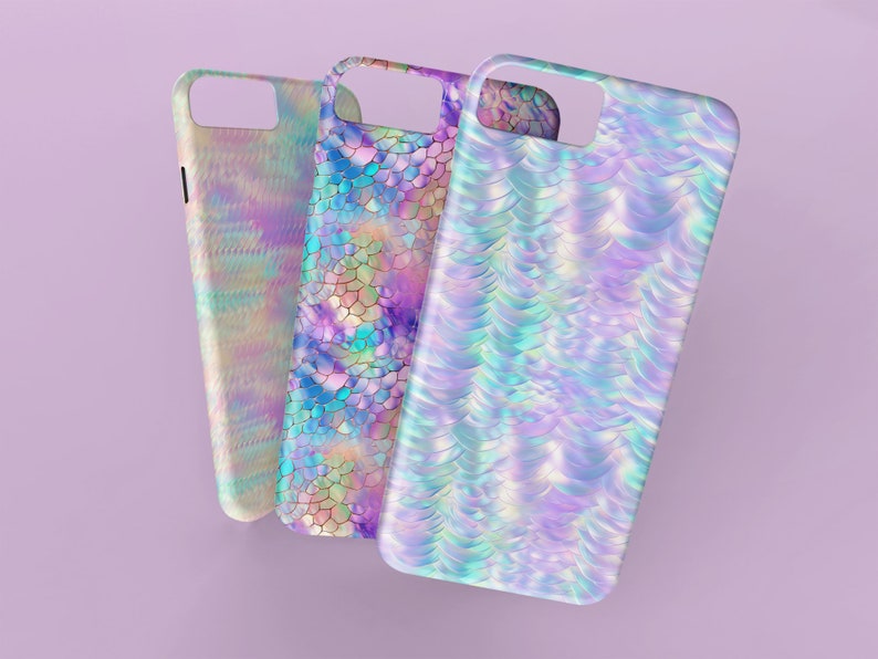 May include: Three iridescent phone cases with different mermaid scale patterns. The cases are all in shades of blue, purple, and pink.