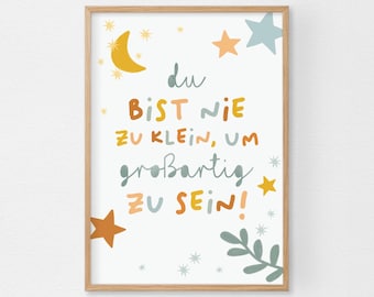 May include: A framed print with a white background features the German phrase "Du bist nie zu klein, um großartig zu sein!" in colorful, whimsical lettering. The design includes illustrations of stars, a crescent moon, and leaves.