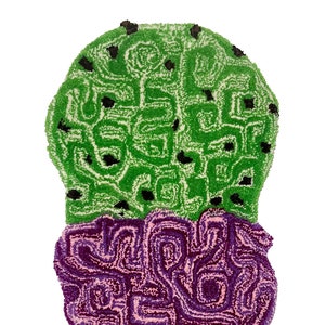 May include: A green and purple ice cream cone rug with a brown and black waffle cone. The ice cream is made of loops of yarn and has a swirl pattern.