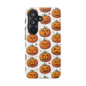 May include: A white smartphone case featuring a repeating pattern of orange jack-o'-lanterns with various facial expressions, including winking, smiling, frowning, and surprised faces, interspersed with small orange stars and speech bubble icons.