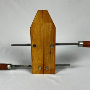 May include: A rustic wooden sign with the text "Welcome to our home" in a handwritten style. The sign features a distressed finish and a simple, inviting design, perfect for a front porch or entryway.