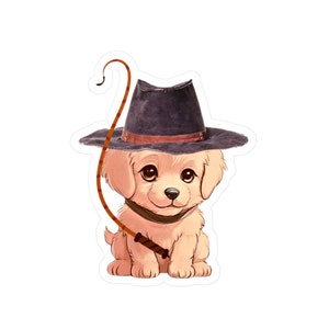 May include: A cartoon illustration of a golden retriever puppy wearing a brown cowboy hat and holding a brown whip. The puppy is sitting with its legs crossed and has a cute expression on its face.