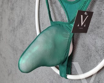 May include: A green mesh thong with a white elastic waistband. The thong has a pouch and a tag with a black and white logo. The garment is made of a sheer, lightweight fabric.