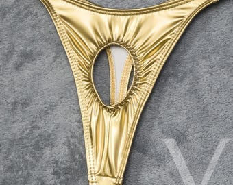 May include: Gold-colored lingerie with a keyhole cutout in the front.