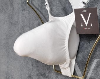 May include: White satin underwear with a supportive pouch design. The garment is suspended on a gold-colored hanger against a gray background. A tag with the text "mens view" is attached.