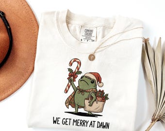 We Get Merry at Dawn Frog Shirt, Funny Christmas Frog Tee, Thrift Lover Holiday Shirt, Cottagecore Frog Gift, Comfort Colors Christmas Tee