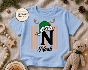 Personalized Christmas Kids Shirt, Kids Name Shirt For Christmas, Holiday Santa Hat T-Shirt, Family Matching Xmas Outfit, Gift for Kids
