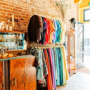 May include: A handmade wooden sign with the text "Welcome" in a handwritten style. The sign is painted white with a distressed finish, and a small green leaf is attached to the top. The sign is designed for home decor.