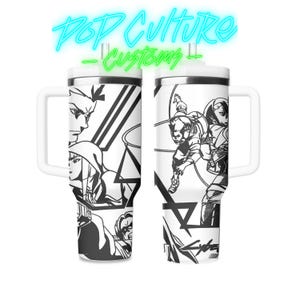 May include: Two white travel mugs with black and white graphic designs. The mug on the left features a group of characters with a geometric pattern. The mug on the right features a group of characters with a geometric pattern. Both mugs have a black handle.