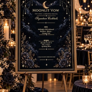May include: A rectangular wedding cocktail menu sign in a gold frame featuring a dark blue night sky background with a crescent moon, stars, and roses. The text reads Moonlit Vow, Signature Cocktails, His Midnight Old Fashioned, and Hers Moonlit French 75.