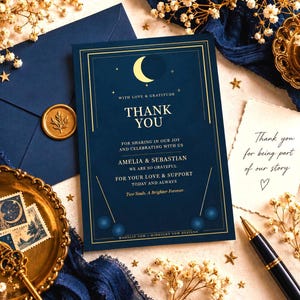 May include: A dark blue thank you card featuring a gold crescent moon and star graphic with the text: WITH LOVE & GRATITUDE THANK YOU FOR SHARING IN OUR JOY AND CELEBRATING WITH US AMELIA & SEBASTIAN WE ARE SO GRATEFUL FOR YOUR LOVE & SUPPORT.