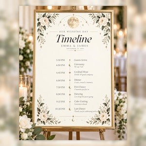 May include: A wedding day timeline sign in a gold frame featuring a cream background with floral accents in the corners, a moon and star graphic at the top, and text listing the schedule for Emma and James on September 14, 2023, from 3:30 PM to 10:30 PM.
