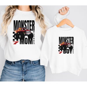 May include: White long-sleeve shirts with a red monster truck graphic and the text "Monster 7 Birthday Mom" and "Monster 7 Birthday Boy".