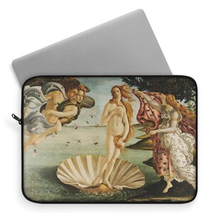 May include: A laptop sleeve featuring a reproduction of Sandro Botticelli's The Birth of Venus painting. The painting depicts a nude woman standing on a giant scallop shell, with two figures in the background.