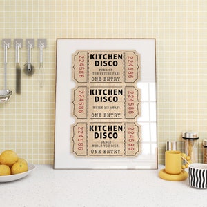 May include: Three vintage-style ticket stubs with the text "Kitchen Disco" printed on them. The tickets have the numbers 224586 printed on them. The text on the tickets reads "Punk up the frying pan!" "Whisk me away!" and "Dance while you dice!"