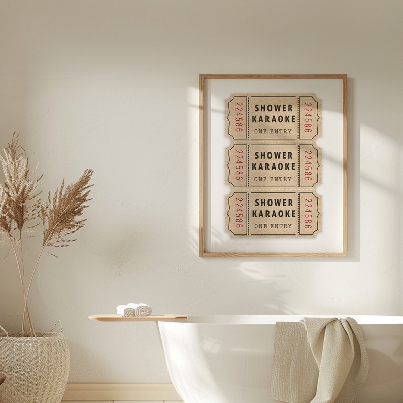 May include: A framed print with three vintage-style tickets that read "Shower Karaoke One Entry" in red text on a beige background.