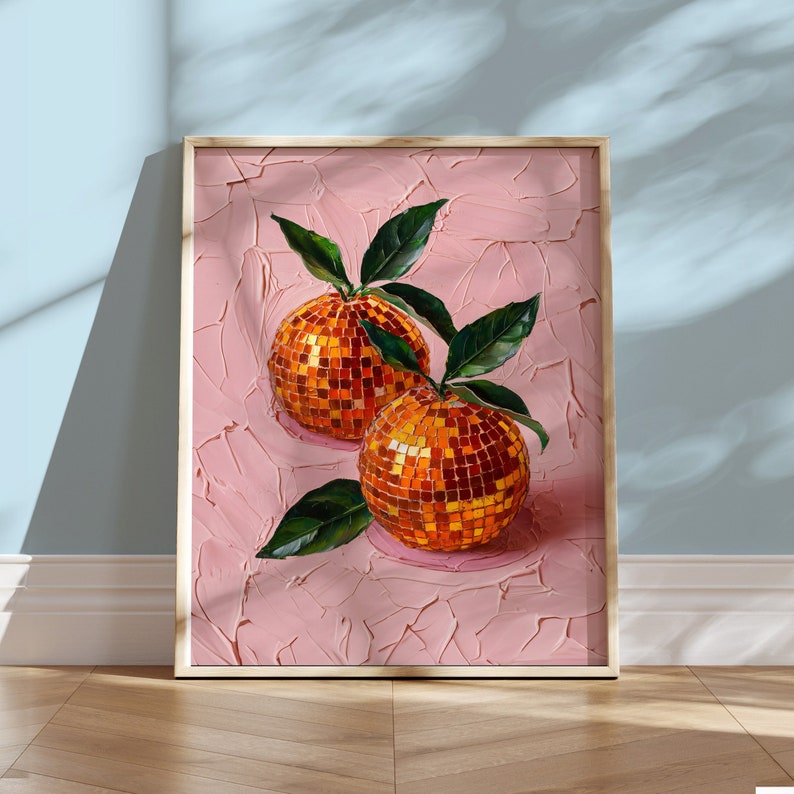 May include: Two orange fruits with a mosaic-like texture, painted in a realistic style on a pink background. The oranges are arranged in a still life composition with green leaves.