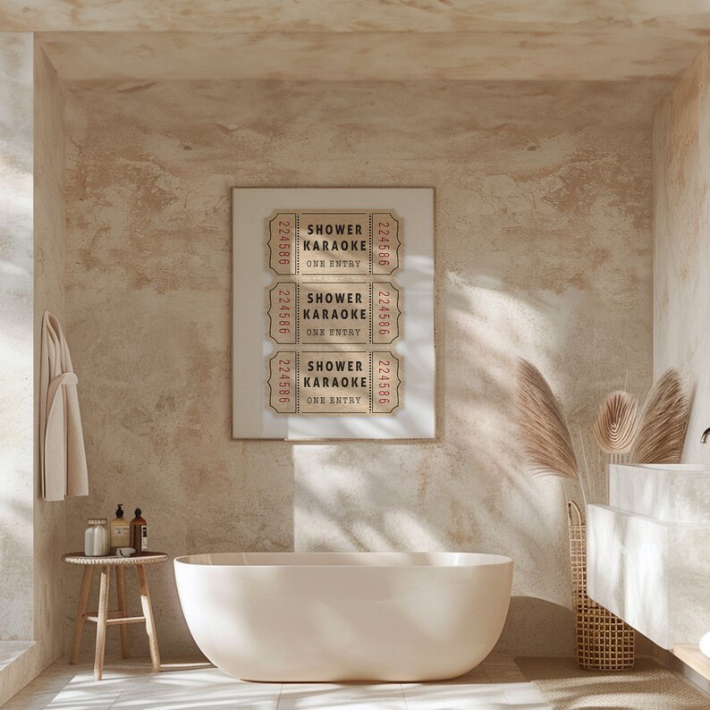 May include: Three vintage-style tickets with the text "Shower Karaoke One Entry" printed on them. The tickets are framed and hung on a beige wall in a bathroom setting.