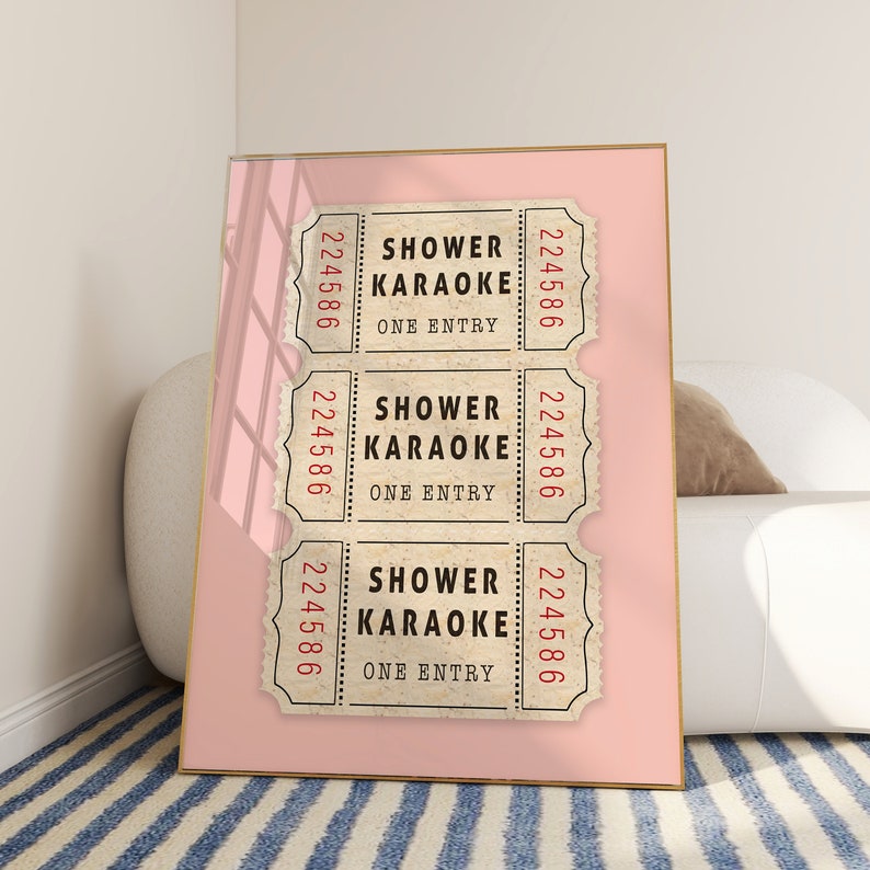 May include: Three vintage-style tickets with the text "Shower Karaoke" and the number "224586" printed on each. The tickets are displayed on a pink background.